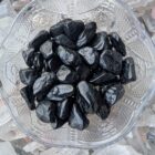 tumbled black tourmaline crystals in a bowl